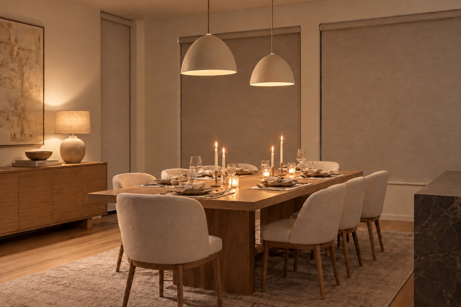 Dining room with warm lights and lowered shades at dusk